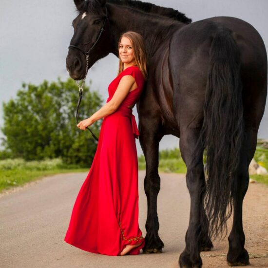 Photo shooting in the Vesuvius National Park with beautiful girl with red dress and black horse